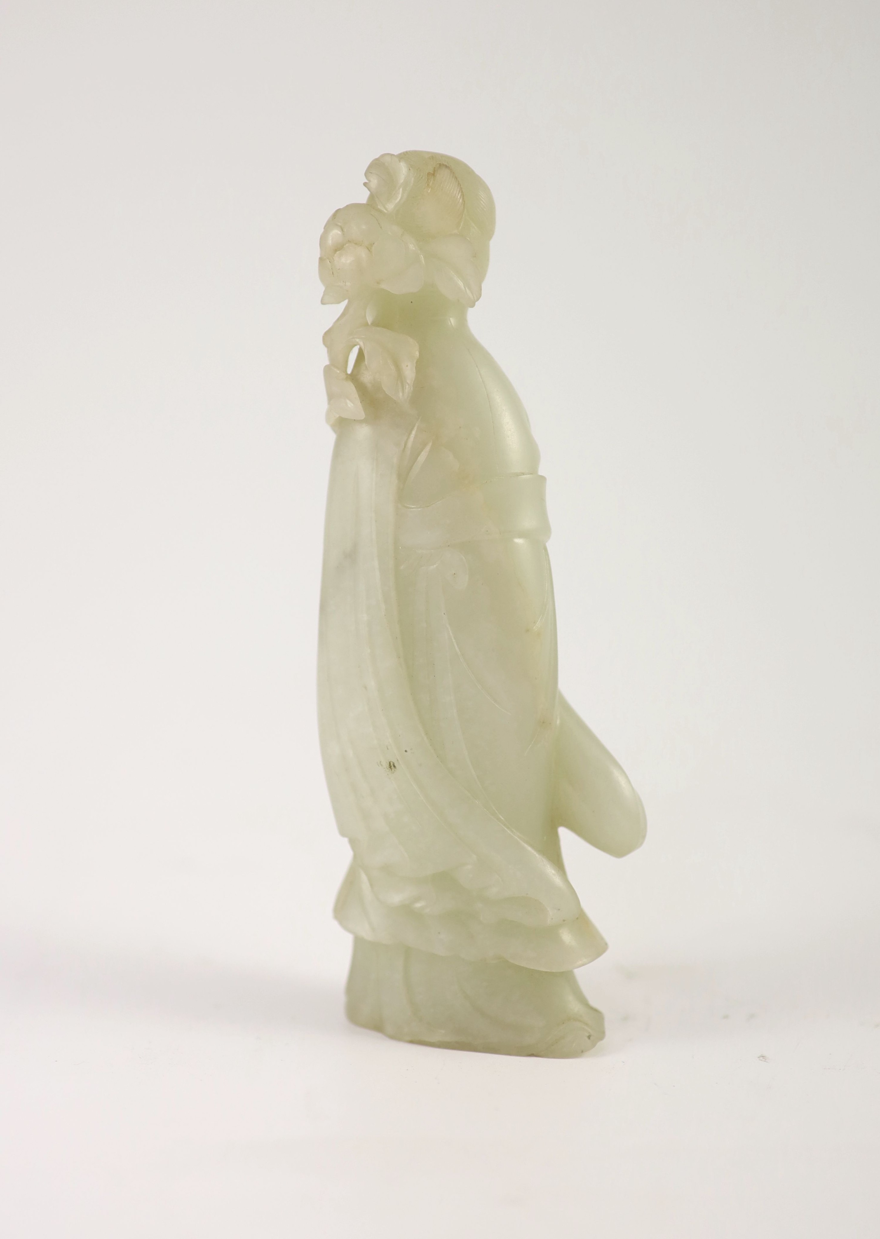 A Chinese pale celadon jade figure of a lady, 18th century